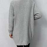 Light gray knit cardigan back view with long sleeves and ribbed hem