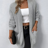 Light gray knit cardigan with open front, long sleeves, and front pockets