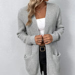 Light gray knit cardigan with open front, long sleeves, and visible front pockets