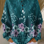 Teal floral print pullover with round neckline and button placket, loose long sleeves