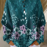 Teal floral print pullover with round neckline and button placket, loose long sleeves