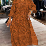 Orange printed V-neck midi dress with 3/4 sleeves and button front