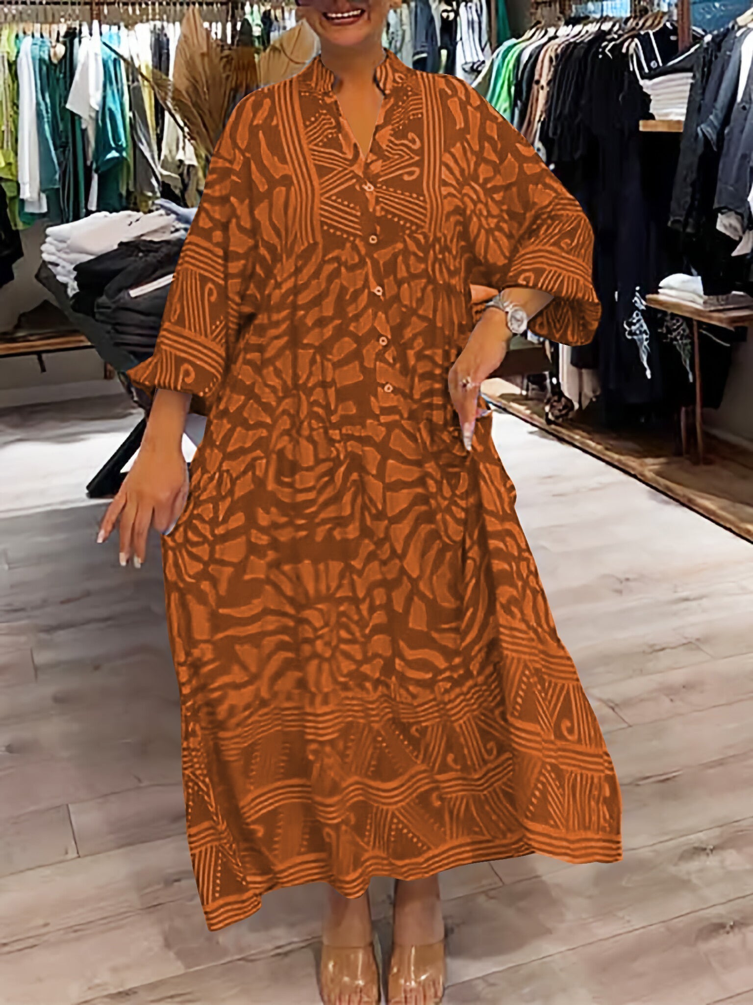 Orange printed V-neck midi dress with 3/4 sleeves and button front