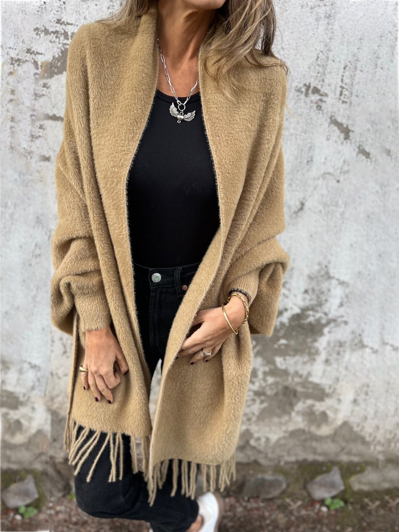 Beige long-sleeve wrap cardigan with fringe trim at cuffs and hem, open front