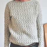 Womens crew-neck knit pullover with long sleeves and speckled stitch pattern