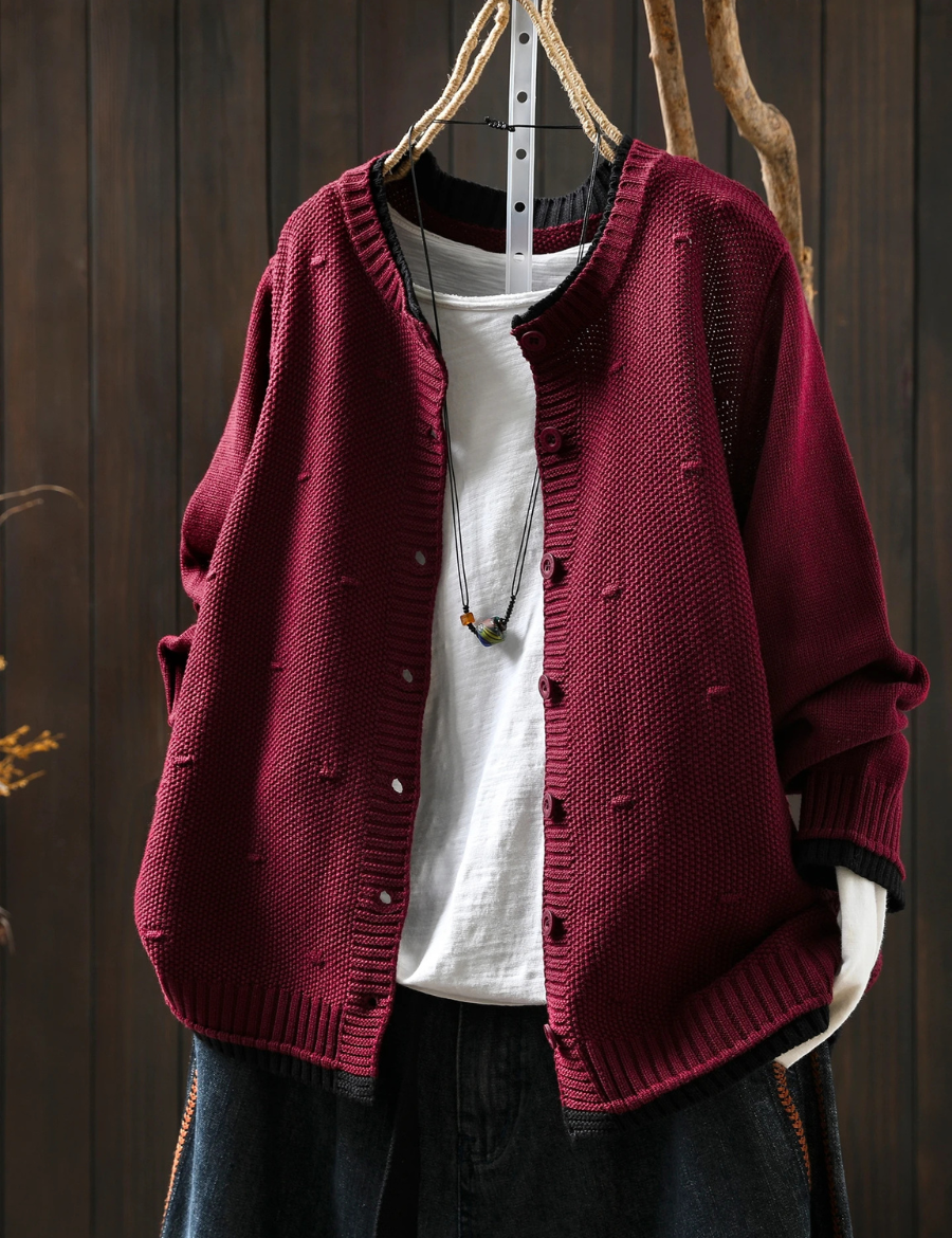 Burgundy structured cardigan with button front, ribbed cuffs, and knit texture