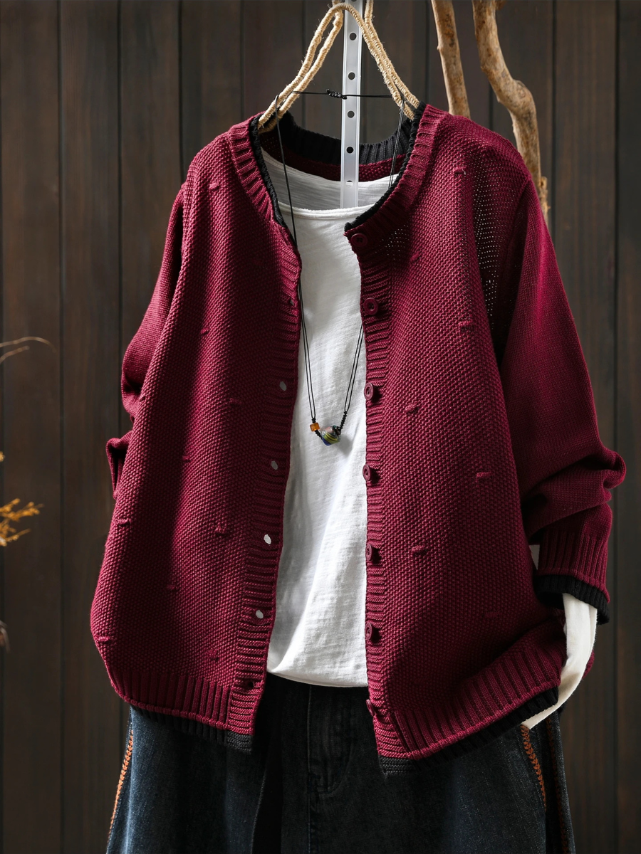 Burgundy structured cardigan with button front, ribbed cuffs, and knit texture