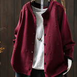 Burgundy structured cardigan with button front, ribbed cuffs, and knit texture