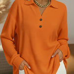 Orange long-sleeve henley pullover with button placket and collar