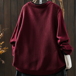 Burgundy knit structured cardigan with crew neckline and button placket