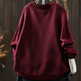 Burgundy knit structured cardigan with crew neckline and button placket