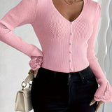 Pink ribbed V-neck button top with lace-trim cuffs and fitted long sleeves