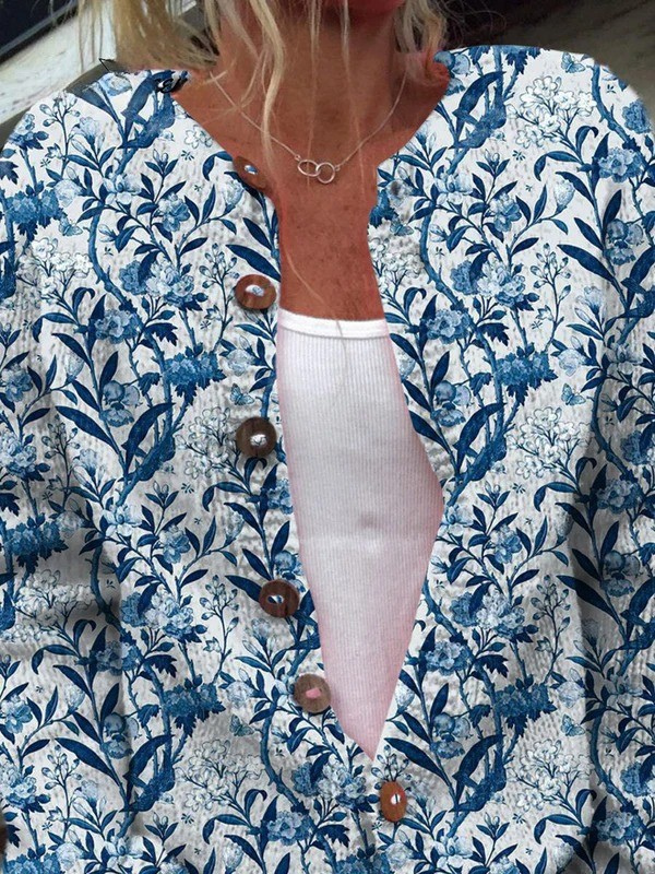Blue and white floral V-neck cardigan with wooden-look button placket
