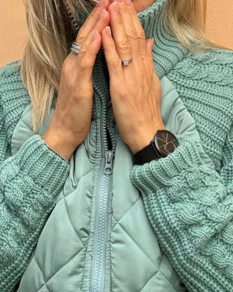 Teal quilted cardigan with full-zip front and chunky knit sleeves