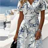 White midi dress with blue botanical print, V-neck, short sleeves, tied waist