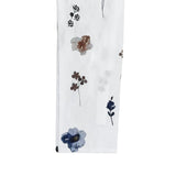 White fabric swatch with floral print in blue and brown tones