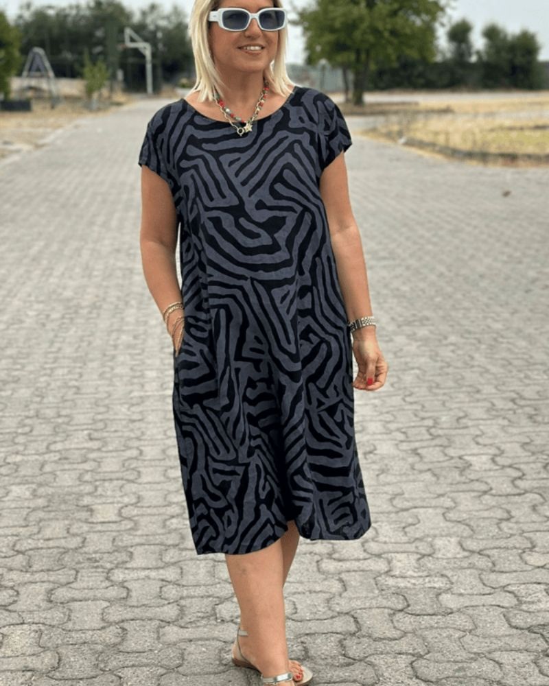 Dark navy zebra-print summer dress, round neckline and short sleeves, knee length