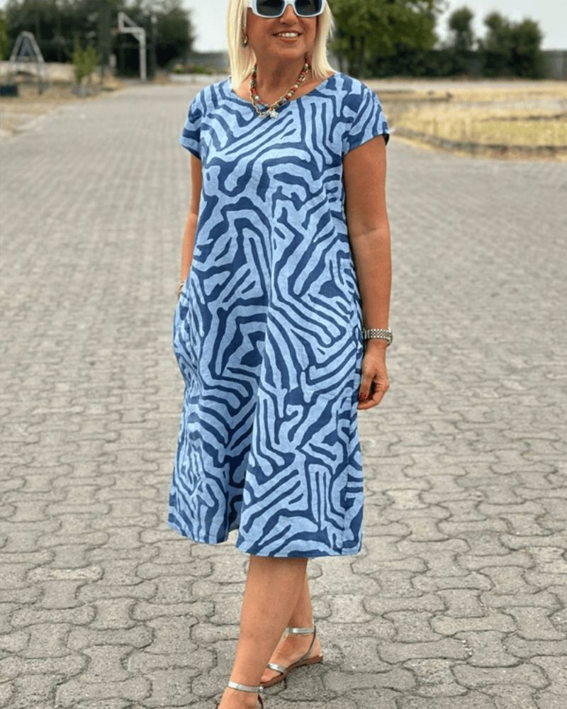 Blue zebra-print summer dress, round neckline and short sleeves, knee length
