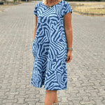 Blue zebra-print summer dress, round neckline and short sleeves, knee length