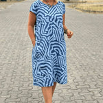 Blue zebra-print summer dress with round neck and short sleeves, relaxed knee length