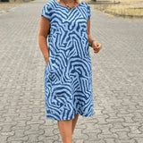 Blue zebra-print summer dress with round neck and short sleeves, relaxed knee length