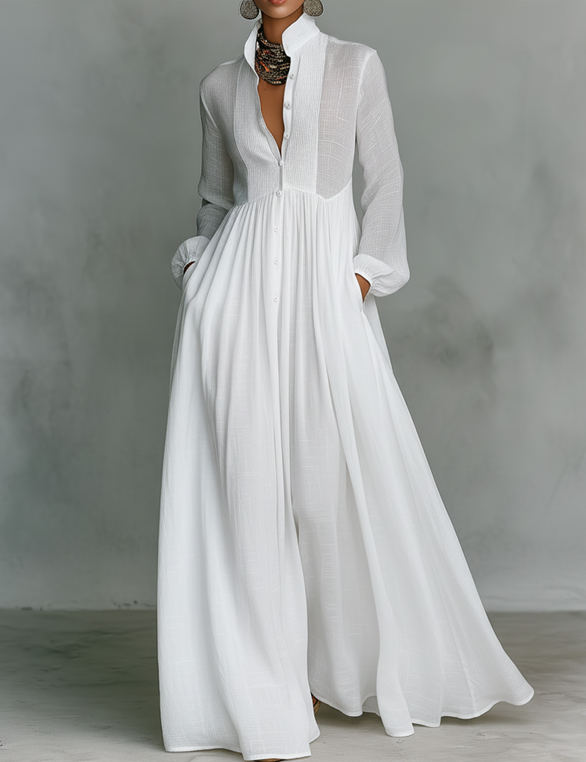 White maxi dress with high collar, long sleeves, button-front and gathered pleated skirt