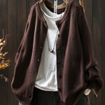 Dark brown structured cardigan with button front and ribbed hem, textured knit