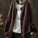 Dark brown structured cardigan with button front and ribbed hem, textured knit