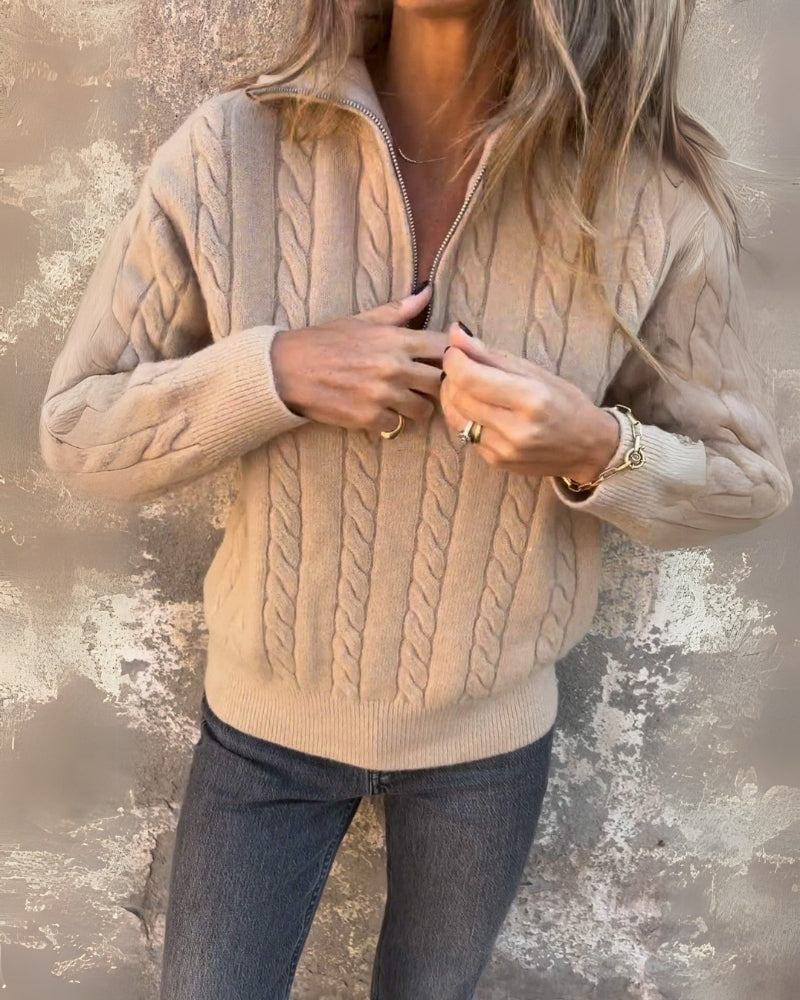 Light beige cable-knit half-zip pullover with long sleeves, ribbed cuffs, zip front