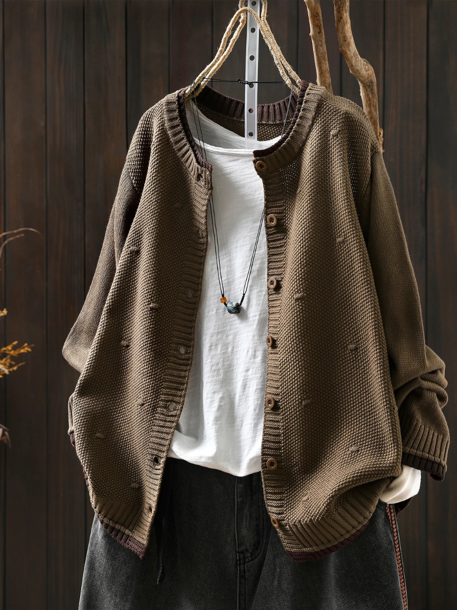 Tan structured cardigan with button front and ribbed cuffs, textured knit fabric