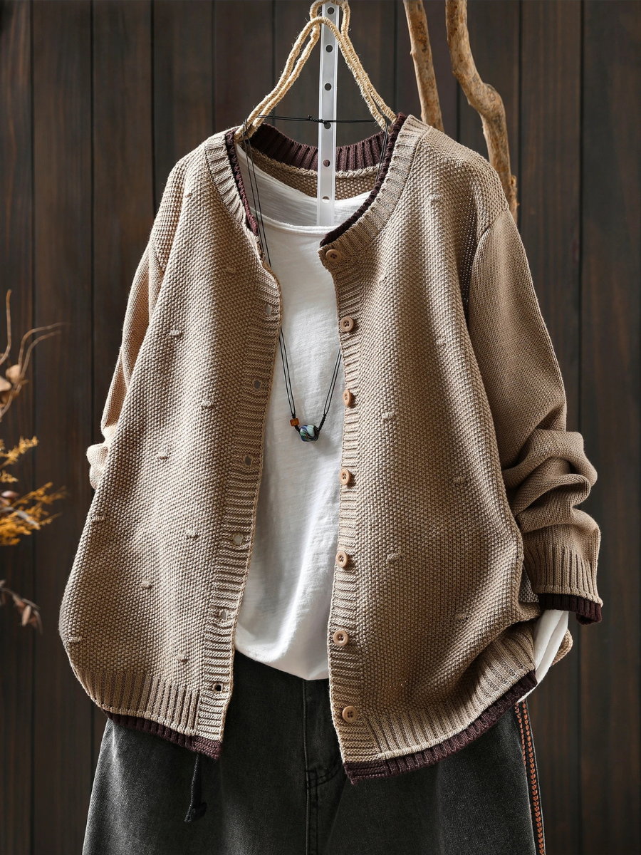 Beige structured cardigan with button placket and ribbed hem, textured knit texture