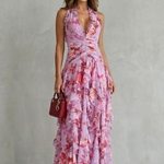 Pink floral halter maxi dress with cinched waist and cascading ruffle tiers