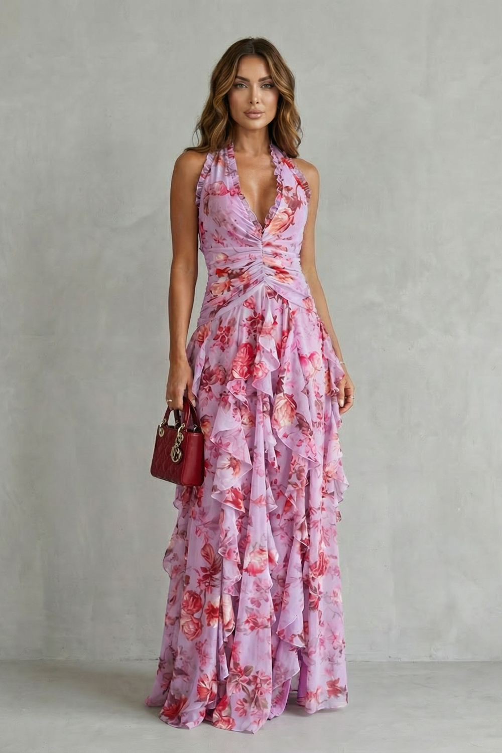 Pink floral halter maxi dress with cinched waist and cascading ruffle tiers