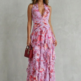 Pink floral halter maxi dress with cinched waist and cascading ruffle tiers