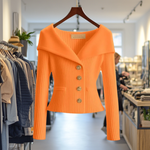 Orange ribbed knit button-front top with long sleeves and peplum hem