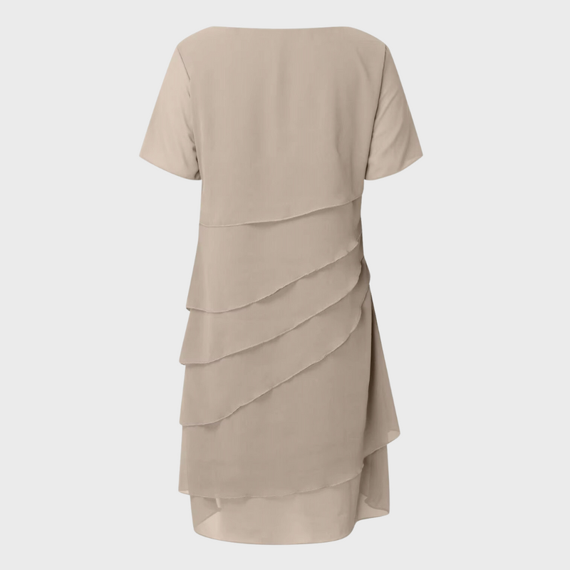 Beige layered chiffon dress back view with short sleeves and cascading tiers
