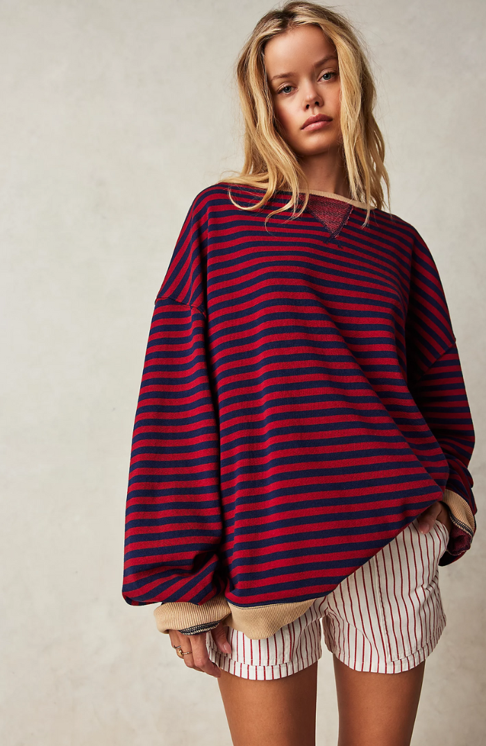 Oversized striped long-sleeve sweater in navy and red with beige cuffs and hem.