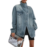 Vintage-washed blue asymmetrical denim jacket with high neck and front button placket