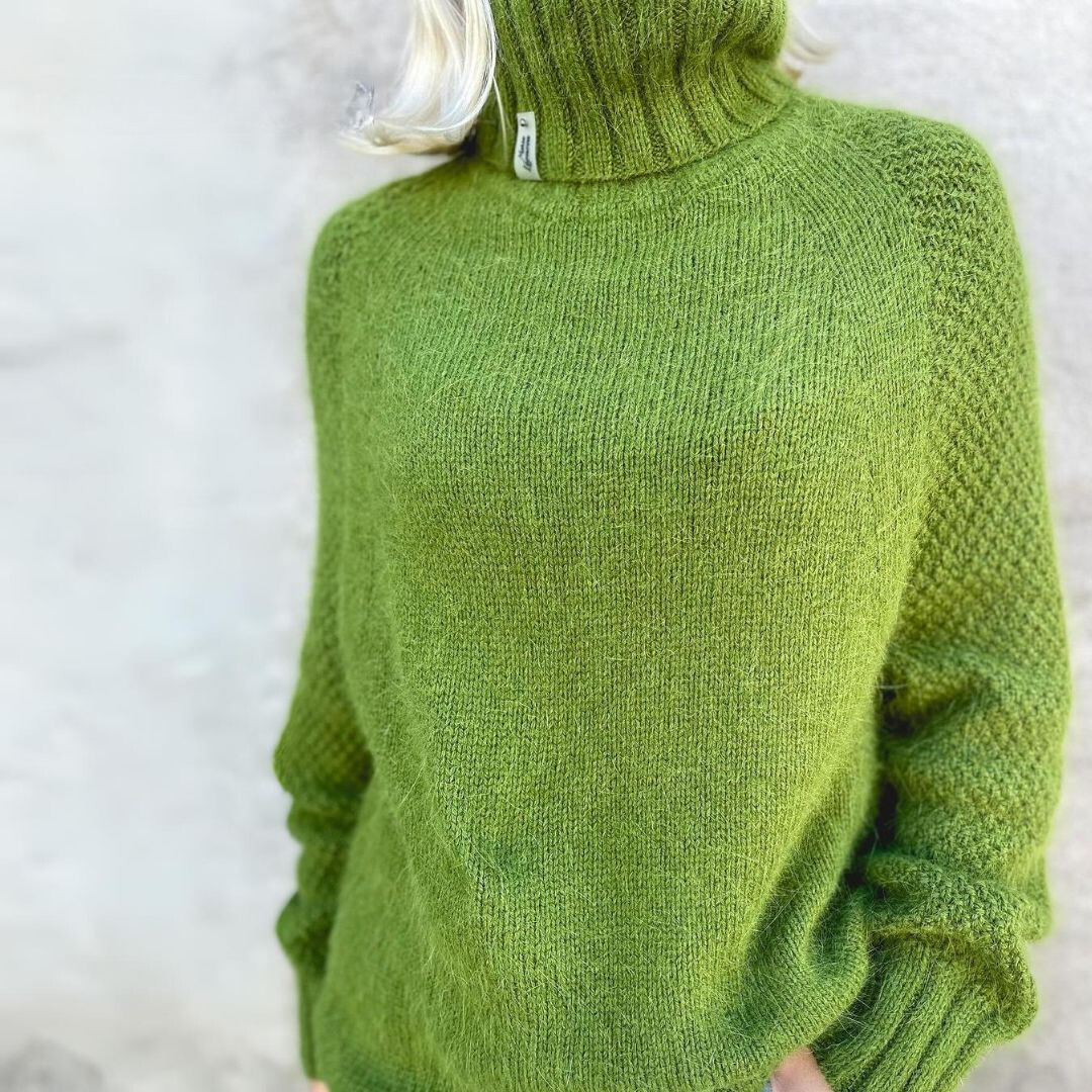 Green knit rollneck sweater, ribbed collar and textured body