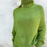 Green knit rollneck sweater, ribbed collar and textured body