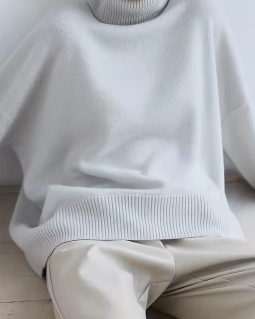 Oversized off-white turtleneck knit sweater with ribbed hem