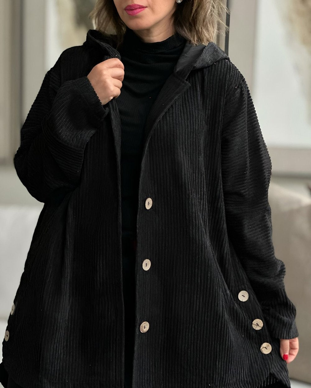 Black corduroy hooded jacket with button front and side pockets