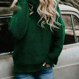 Green roll-neck knitted sweater with long sleeves and ribbed hem.
