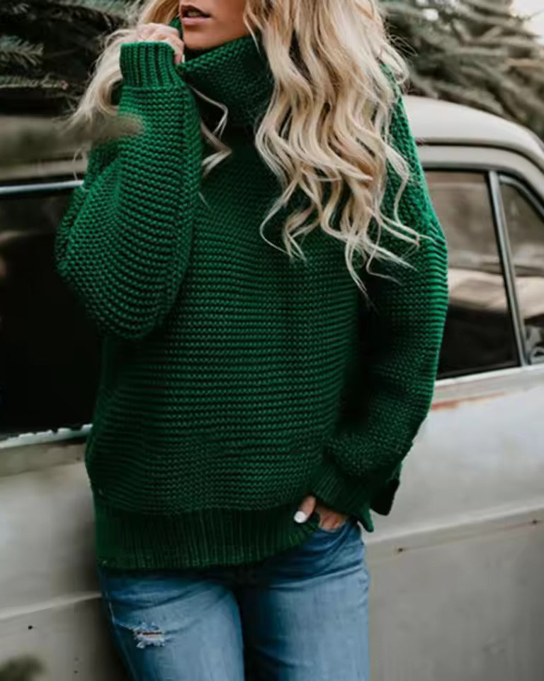 Green roll-neck knitted sweater with long sleeves and ribbed hem.