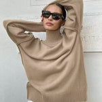 Beige knit turtleneck sweater with wide sleeves and ribbed hem