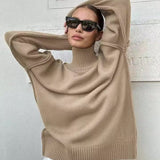 Beige knit turtleneck sweater with wide sleeves and ribbed hem