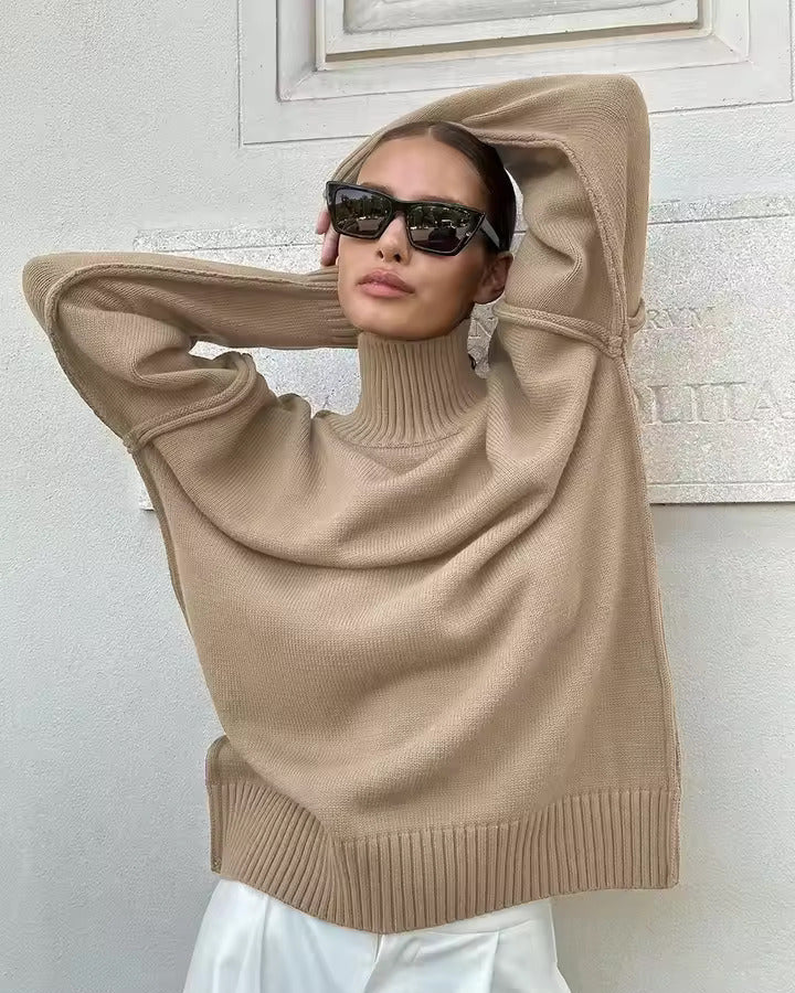 Beige knit turtleneck sweater with wide sleeves and ribbed hem