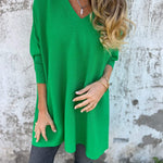 Green V-neck pullover sweater with three-quarter sleeves and loose, tunic-style fit.