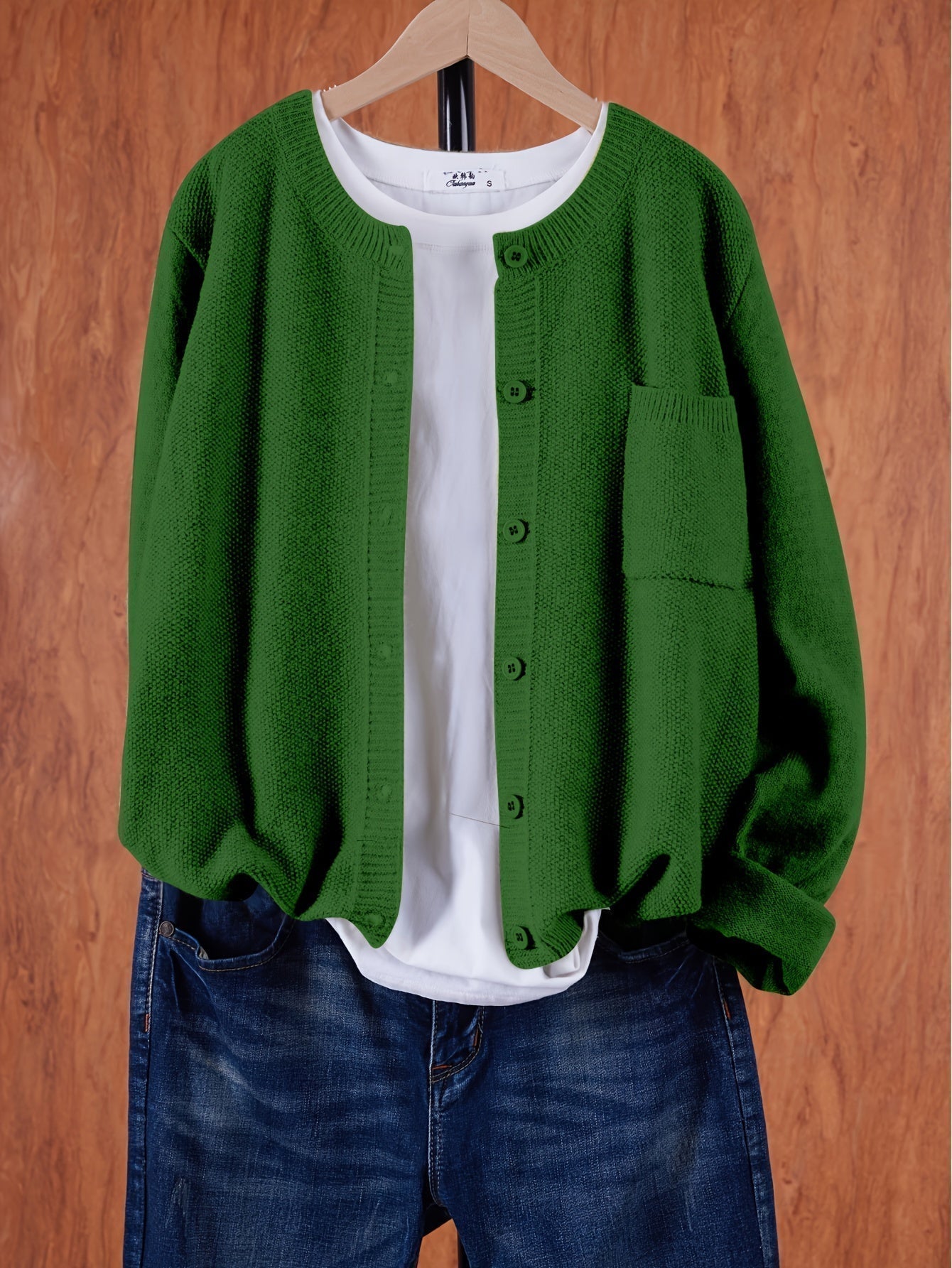 Green round-neck cardigan with button front and side pocket