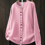 Pink cardigan sweater with button front and ribbed crew neckline